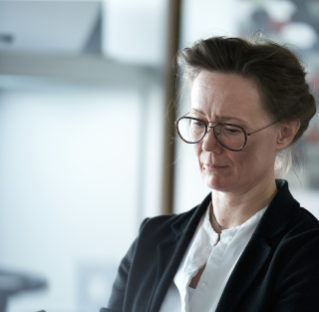 Woman with glasses in office environment