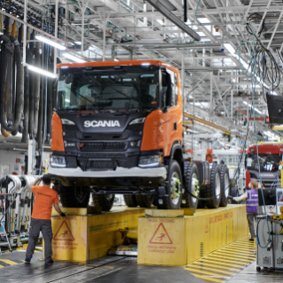 Orange truck in chassis assembly