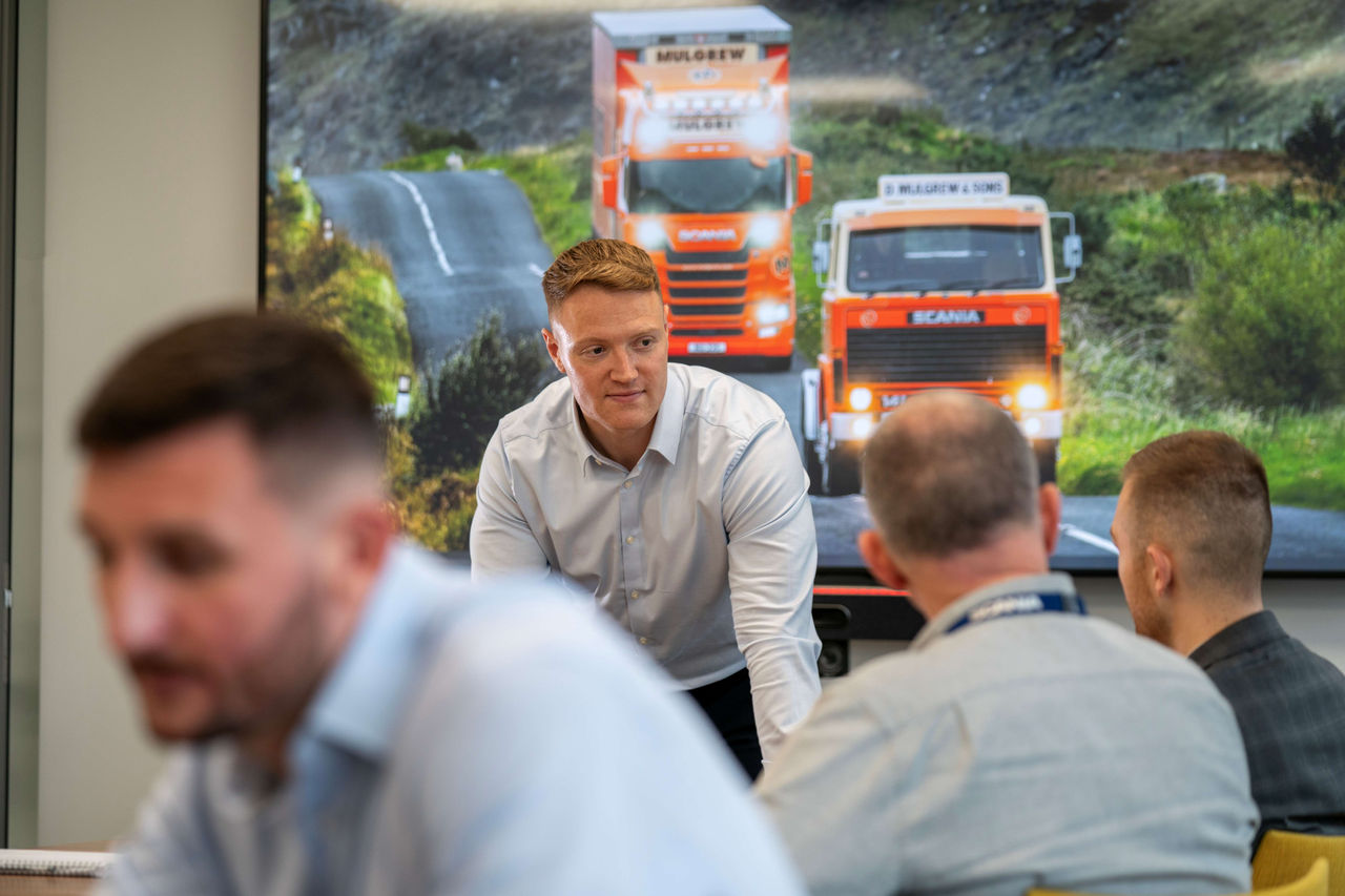 Scania colleagues standing in office at MK Head Office