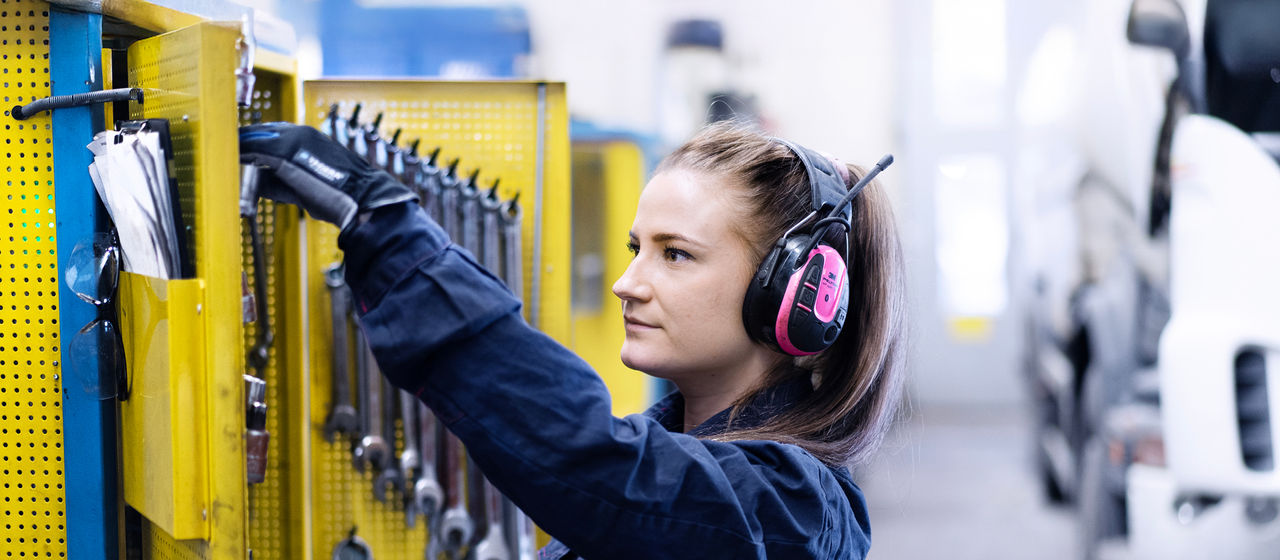 Technician working under a Scania truck