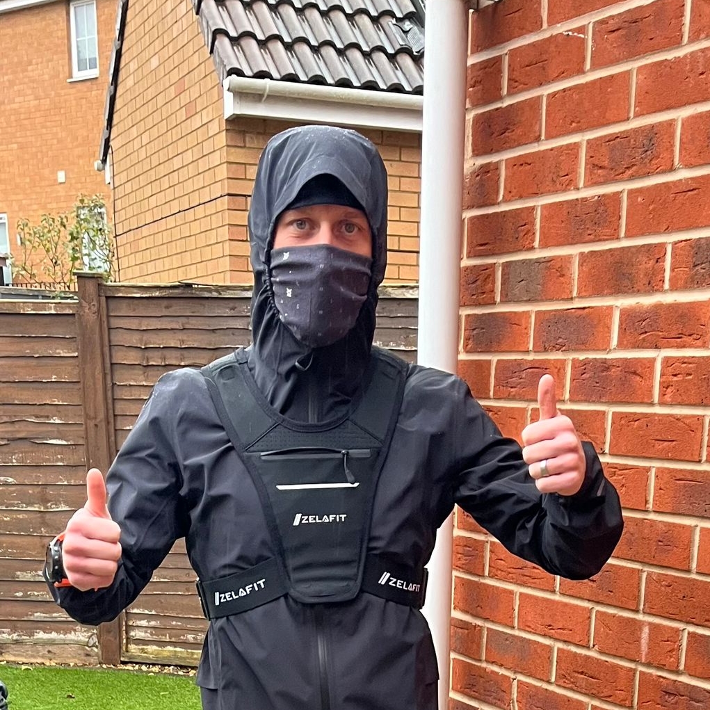 Photo of young man standing with thumbs up in a jacket