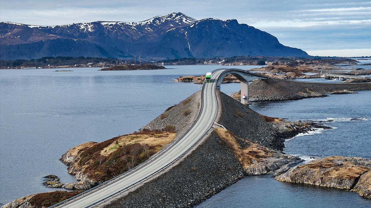 Scania Super truck driving on a road by the water